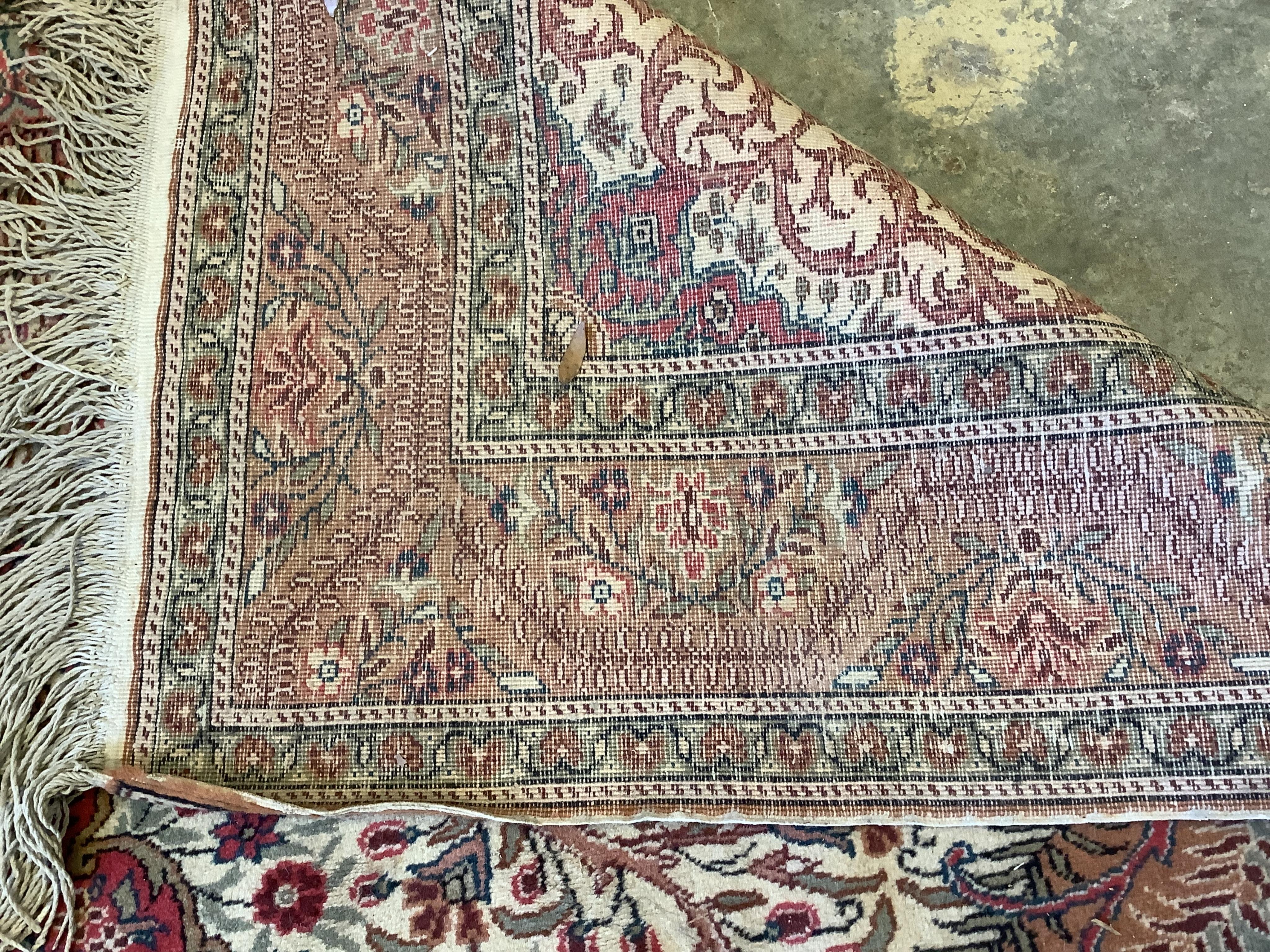 A Persian style beige ground carpet, 290 x 197cm. Condition - fair to good